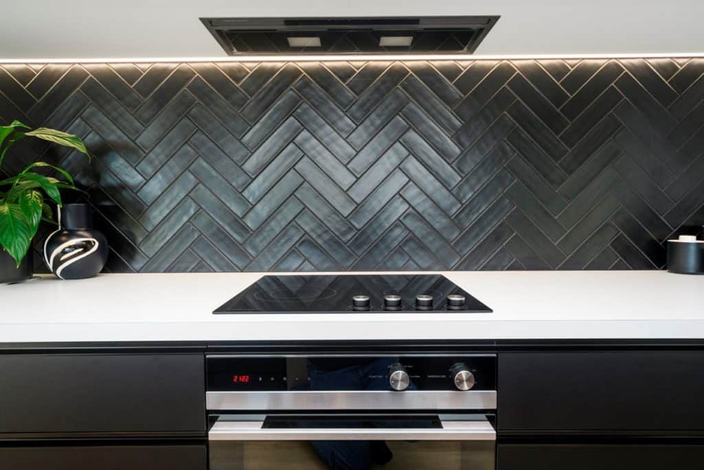 Chevron splashback tiles kitchen by Fowler Homes Manawatu